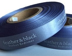 Logo Printed Onto A Dark Grey Ribbon