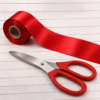 Red Handled Scissor and red ribbon