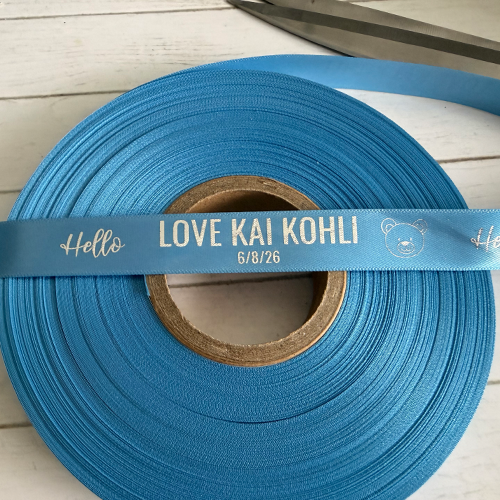 cornflower blue ribbon with a silver metallic print