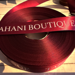 Burgundy 25mm Satin Ribbon With White Logo From A Clothing Boutique For Christmas Gift Wrapping