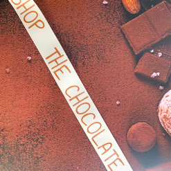 Cream Ribbon Repeat Logo in Brown