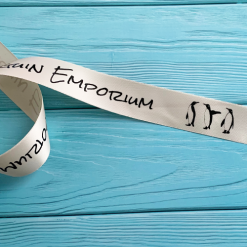 Cream Ribbon With Black Logo Print Repeated