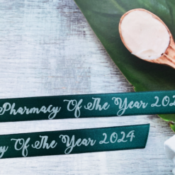 Logo Printed Onto A Dark Green Ribbon