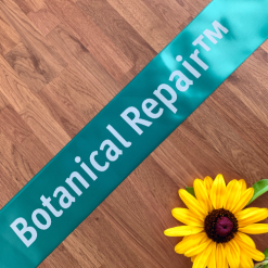 Logo Printed Onto A Teal Ribbon