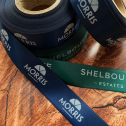 Logo Printed Onto A Dark Green Ribbon