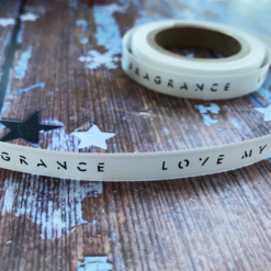 Logo Printed On An Off White Ribbon