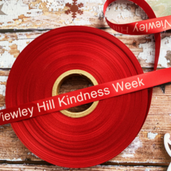 Logo Printed Onto A Red Ribbon