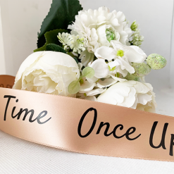 Logo Printed Onto A Rose Gold Ribbon