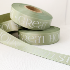 Logo Printed Onto A Sage Green Ribbon