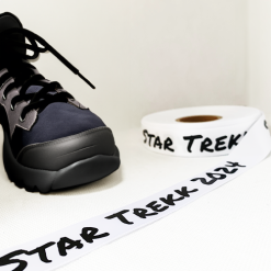White 25mm black logo print for a hospice charity