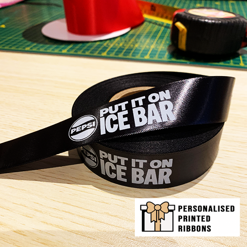 White Logo Print Onto A Black Satin Inch Wide Ribbon by Personalised Printed Ribbons Near London Next Day Delivery