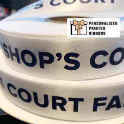 White Ribbon Printed With Navy Logo Print For Hampers by Personalised Printed Ribbons Company Near London