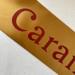 Logo Printed Onto An Antique Gold Ribbon