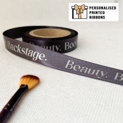 Charcoal Ribbon Printed With Silver Grey Logo For A Theatre