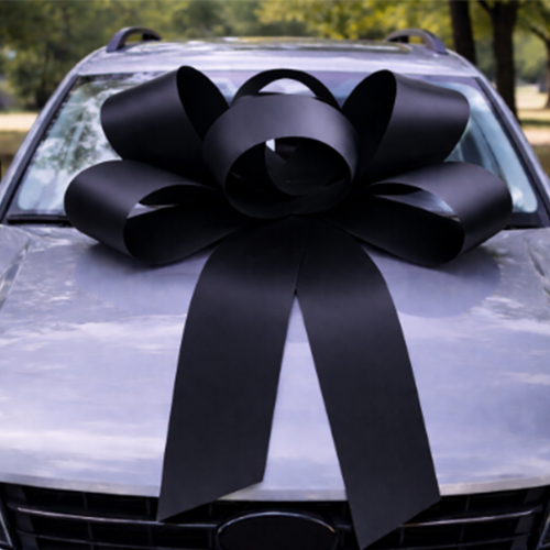 Black bow on bonnet of a car