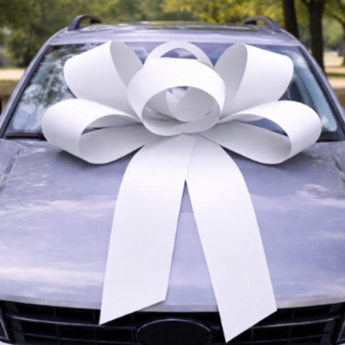 White bow on bonnet of a car