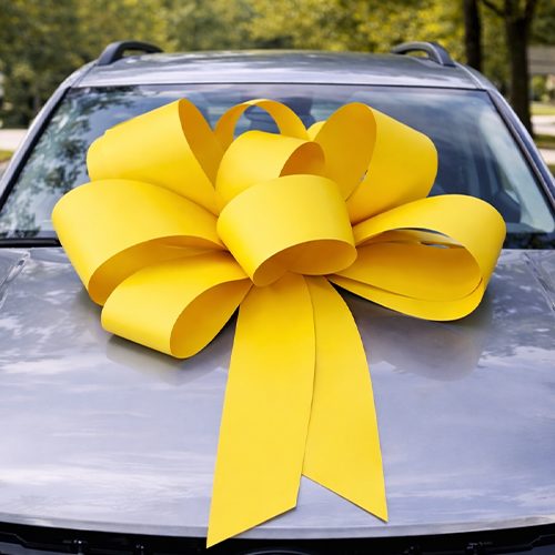 Yellow bow on bonnet of a car