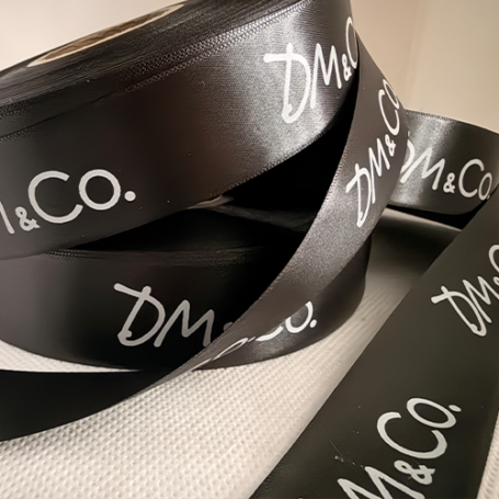 Black Ribbon With White Logo Print Our Speciality